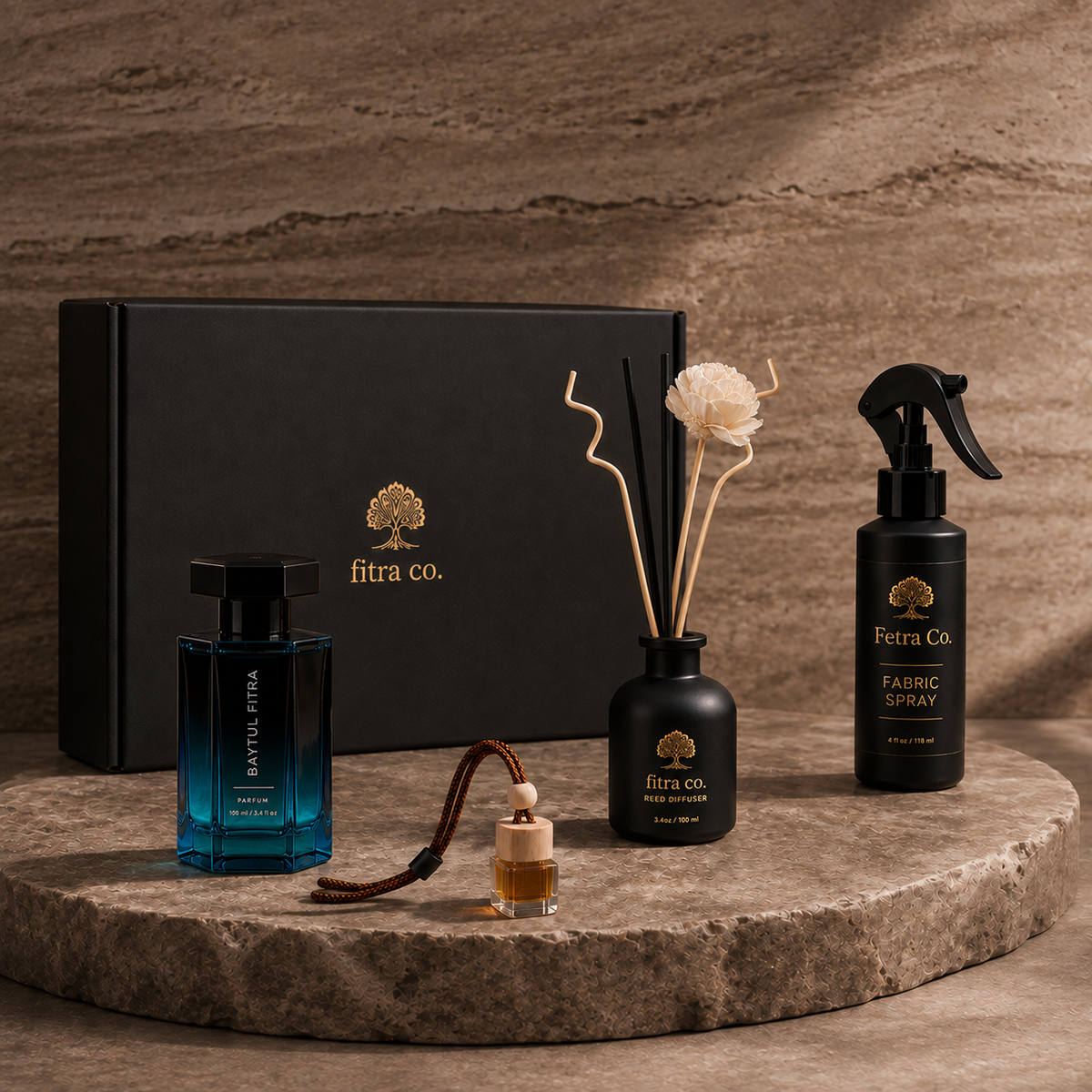 Four-piece Plus Gift Set with branded gift box on an oval travertine platform.