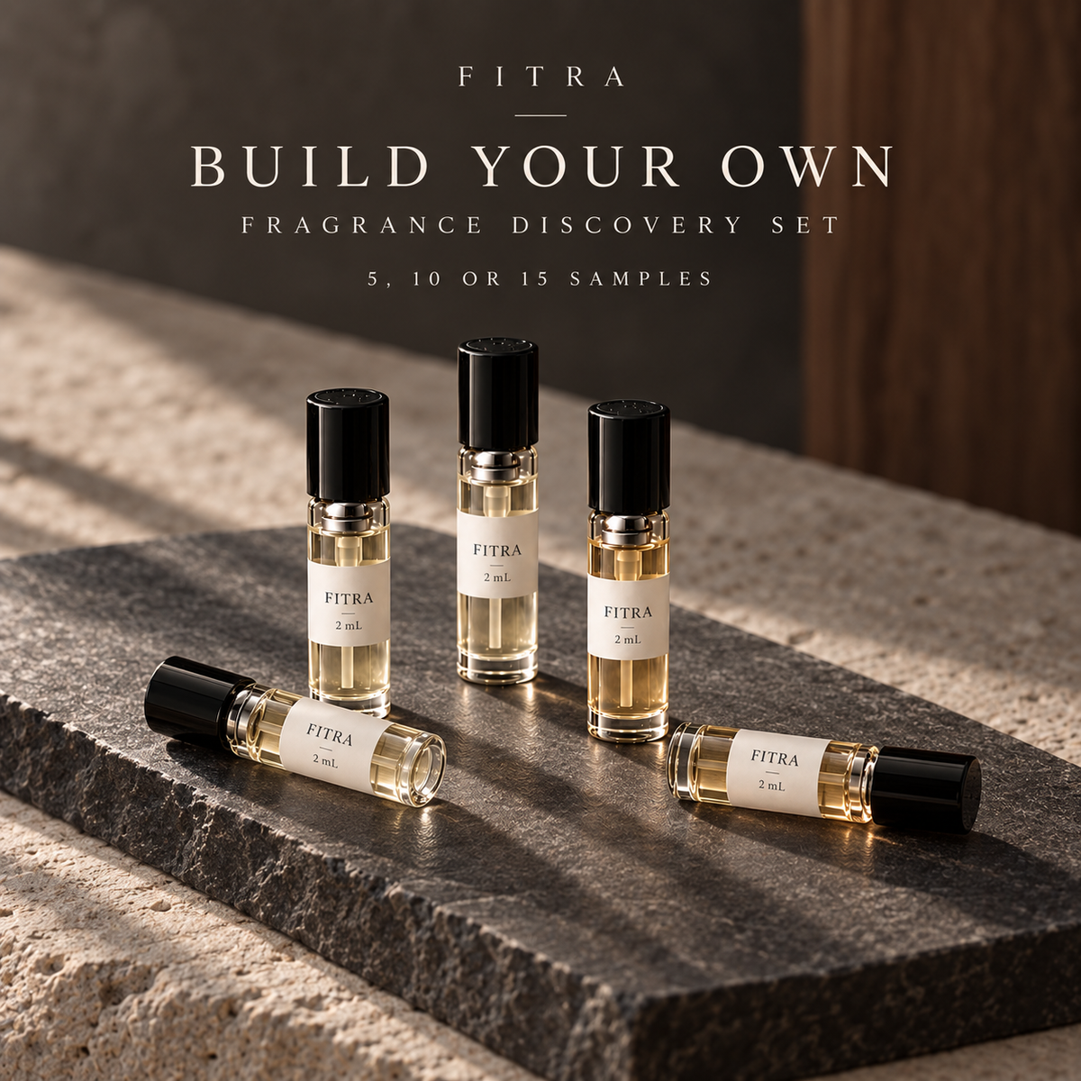 Build Your Own Fragrance Discovery Set: five roll-on sample bottles on dark natural stone. Choose 5, 10 or 15 samples.